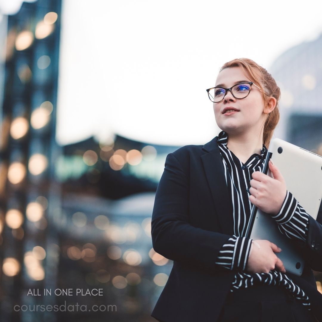 Confident woman in business attire.