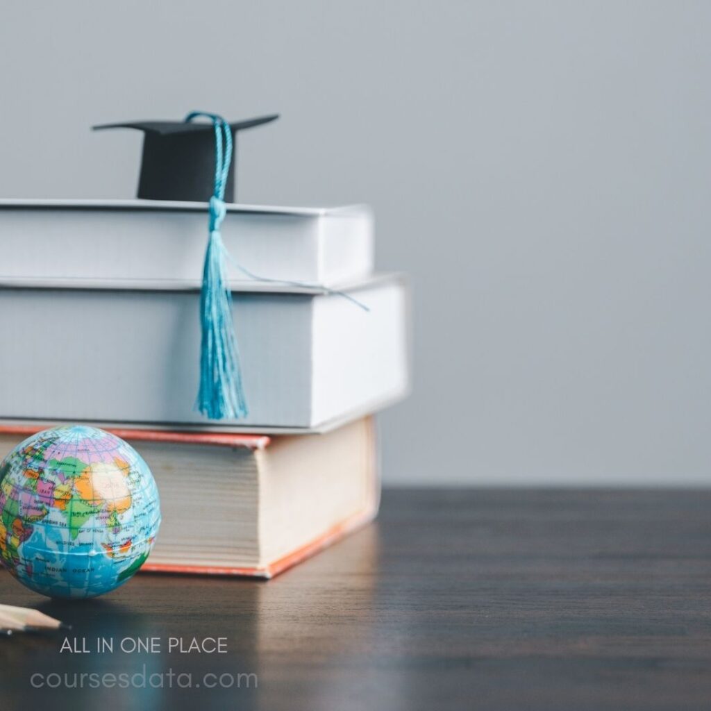 Graduation cap atop stacked books.