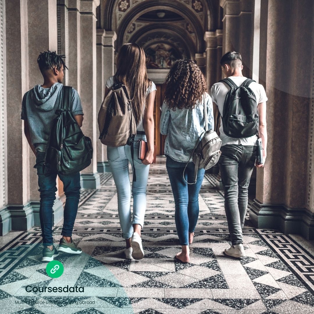 Students walking through hall.