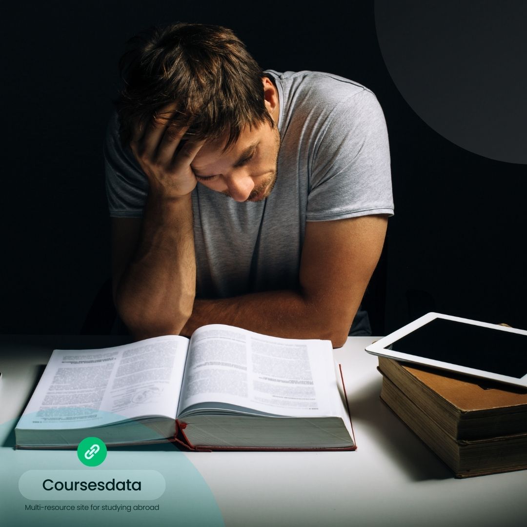 Stressed man studying at night.