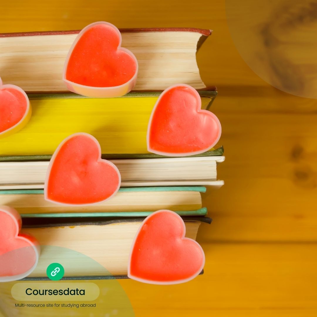 Colorful heart-shaped soaps atop books.