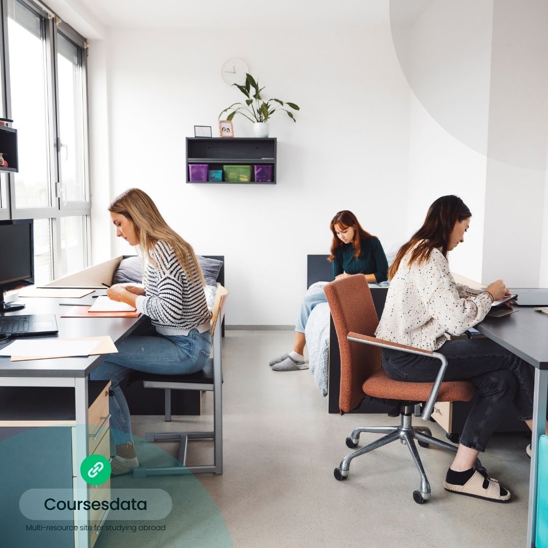 Students studying in modern workspace.