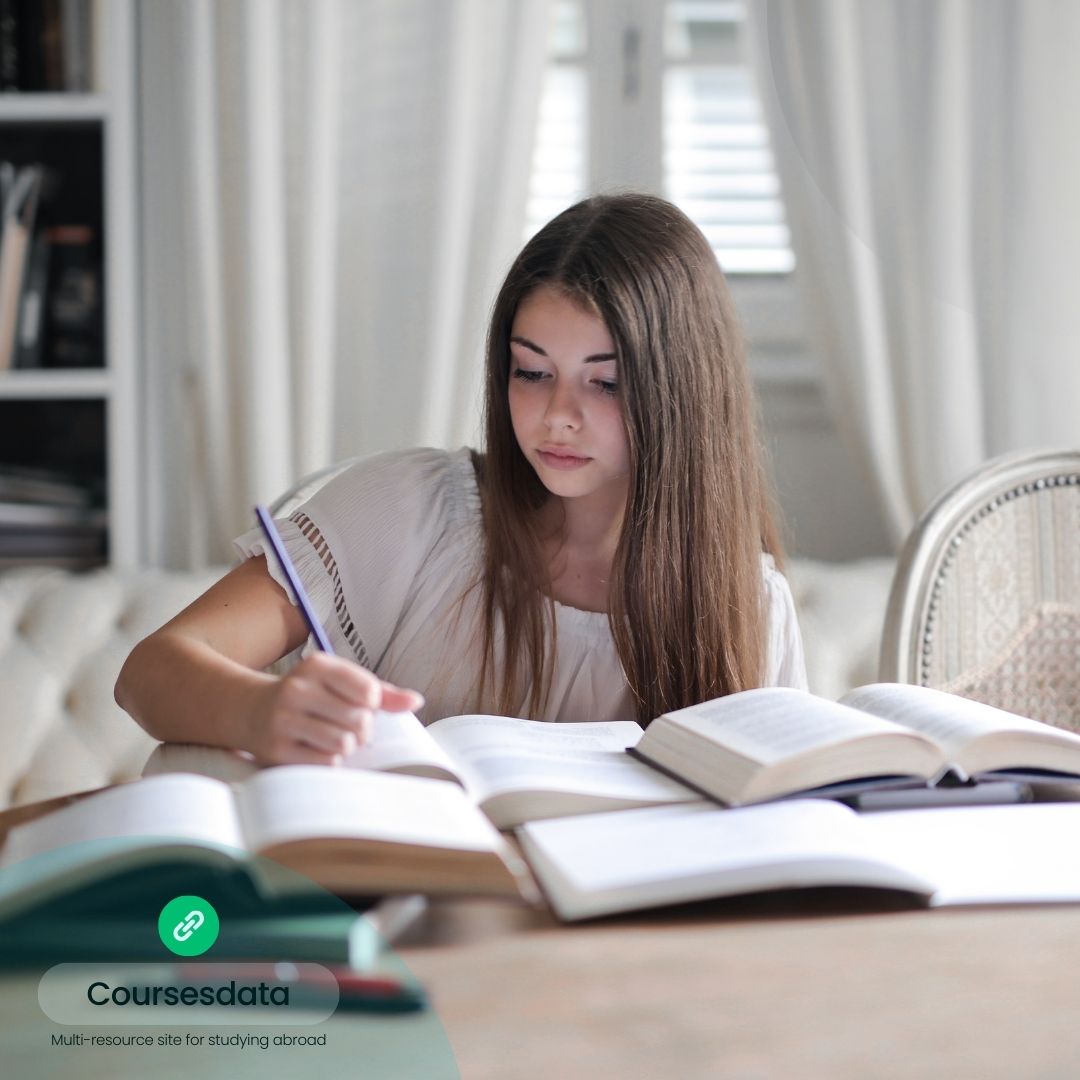 Girl studying with open books.
