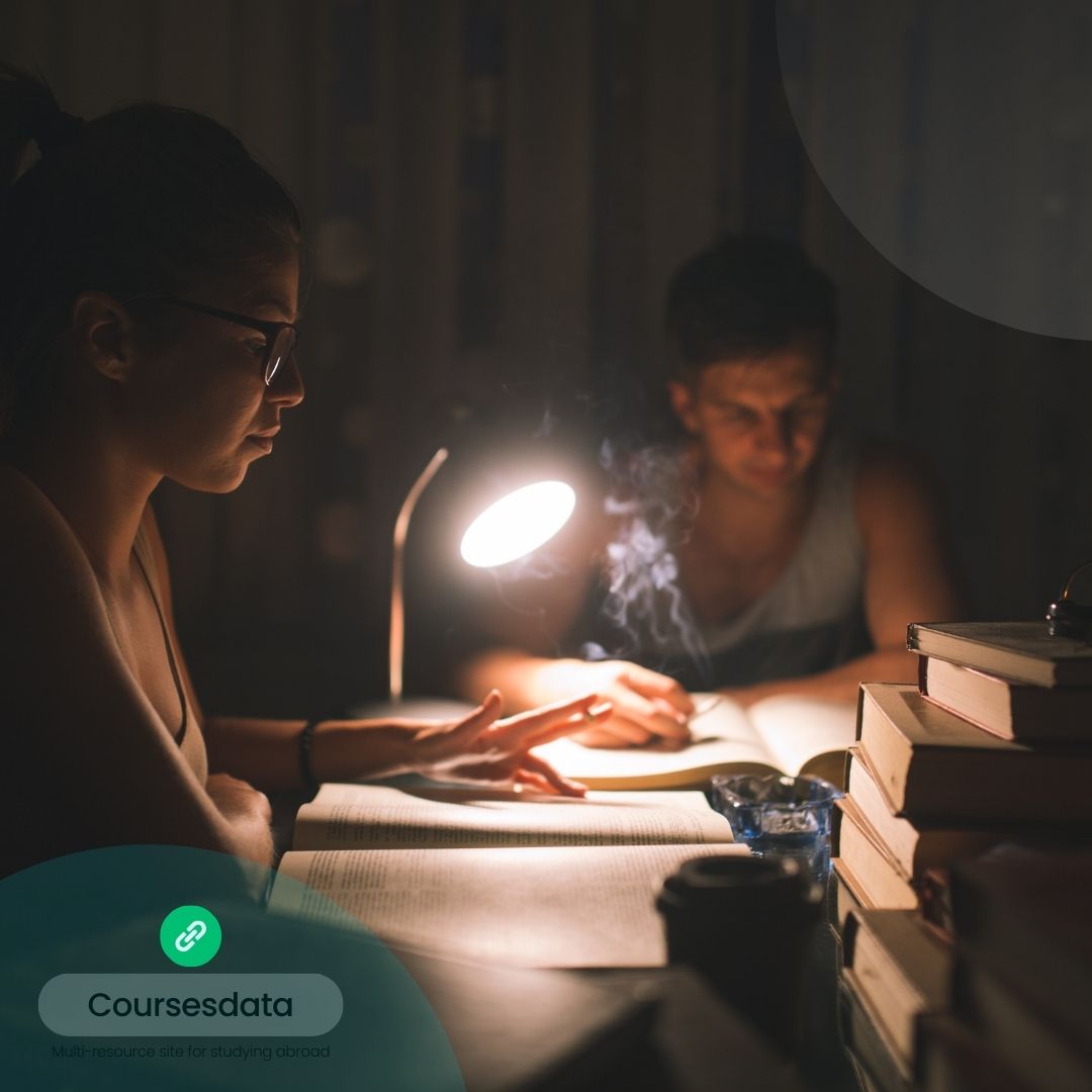 Studying together in dimly lit room.