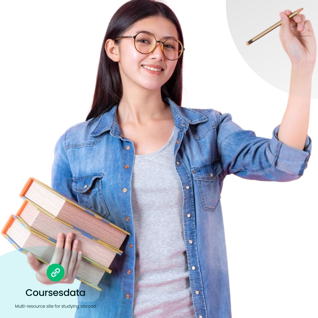 Smiling student holding books.