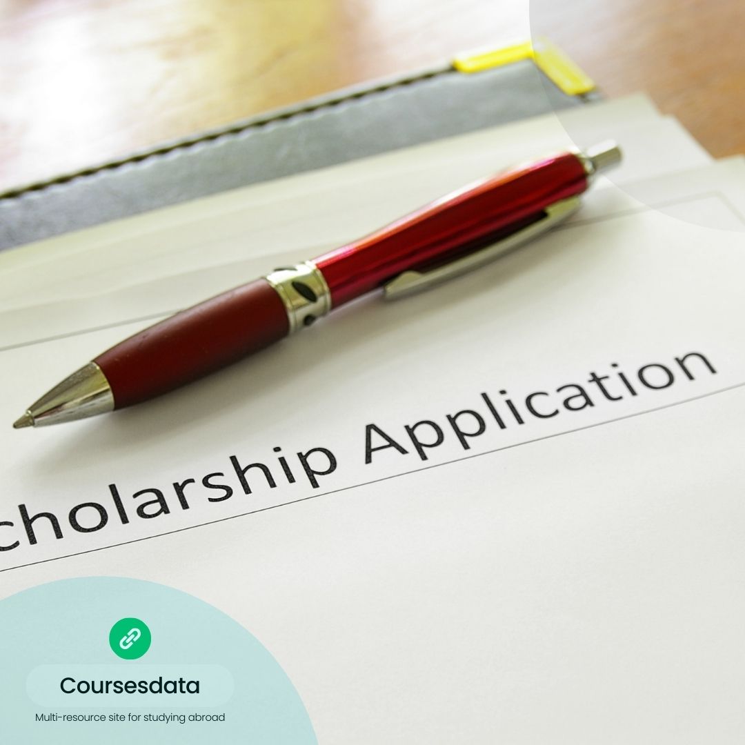 Scholarship application with red pen.