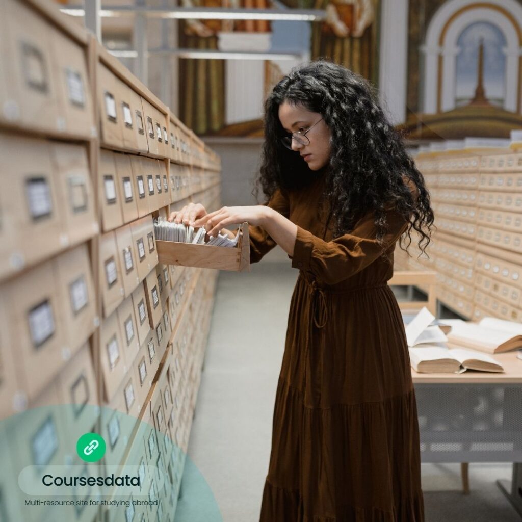 Woman organizing index cards.