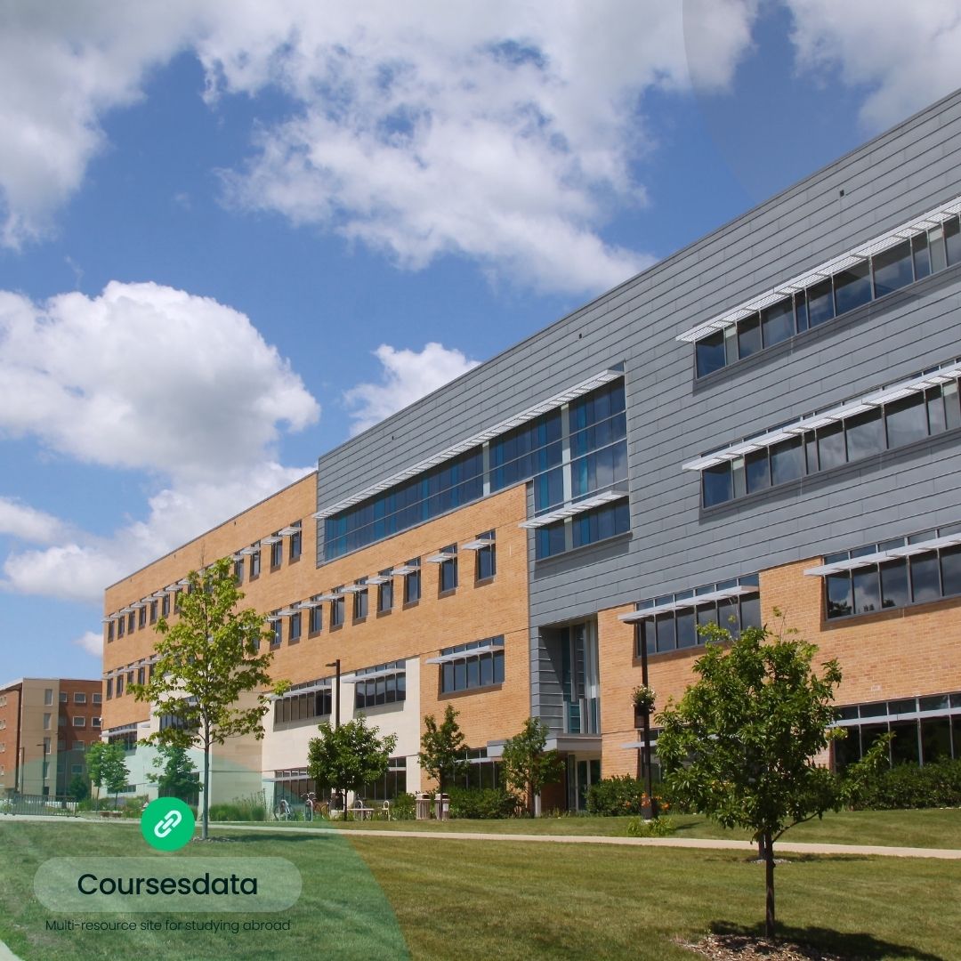 Modern building with green landscape.