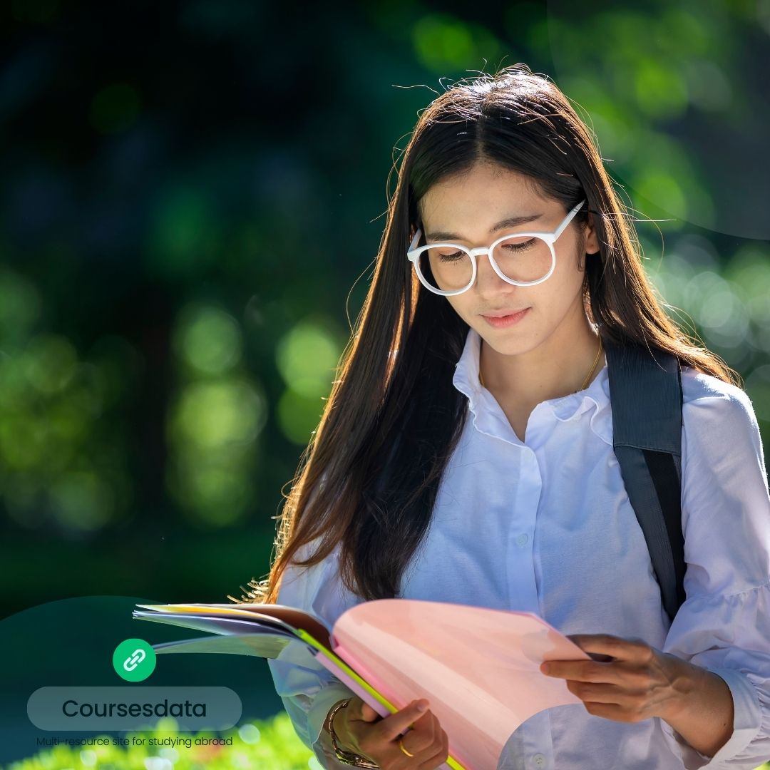 Young woman reading outdoors.