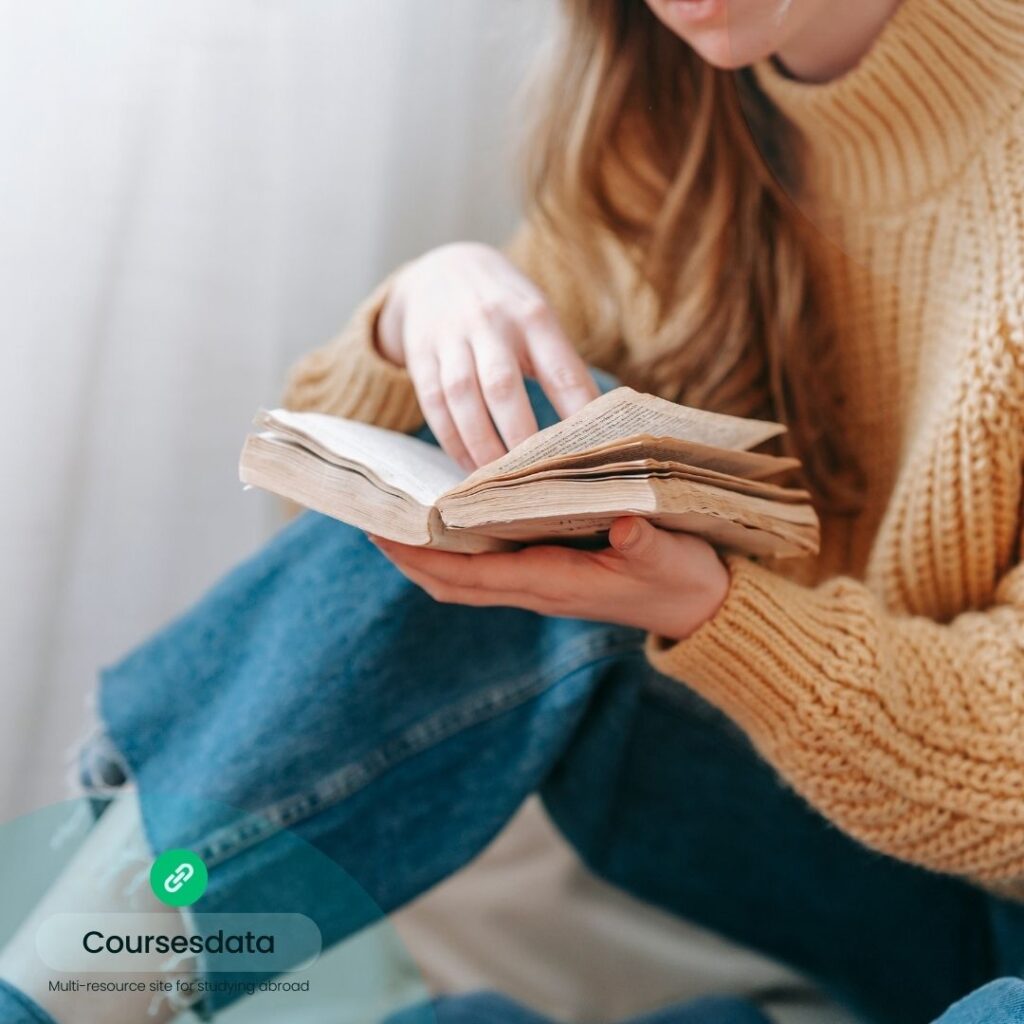 Person reading an open book.