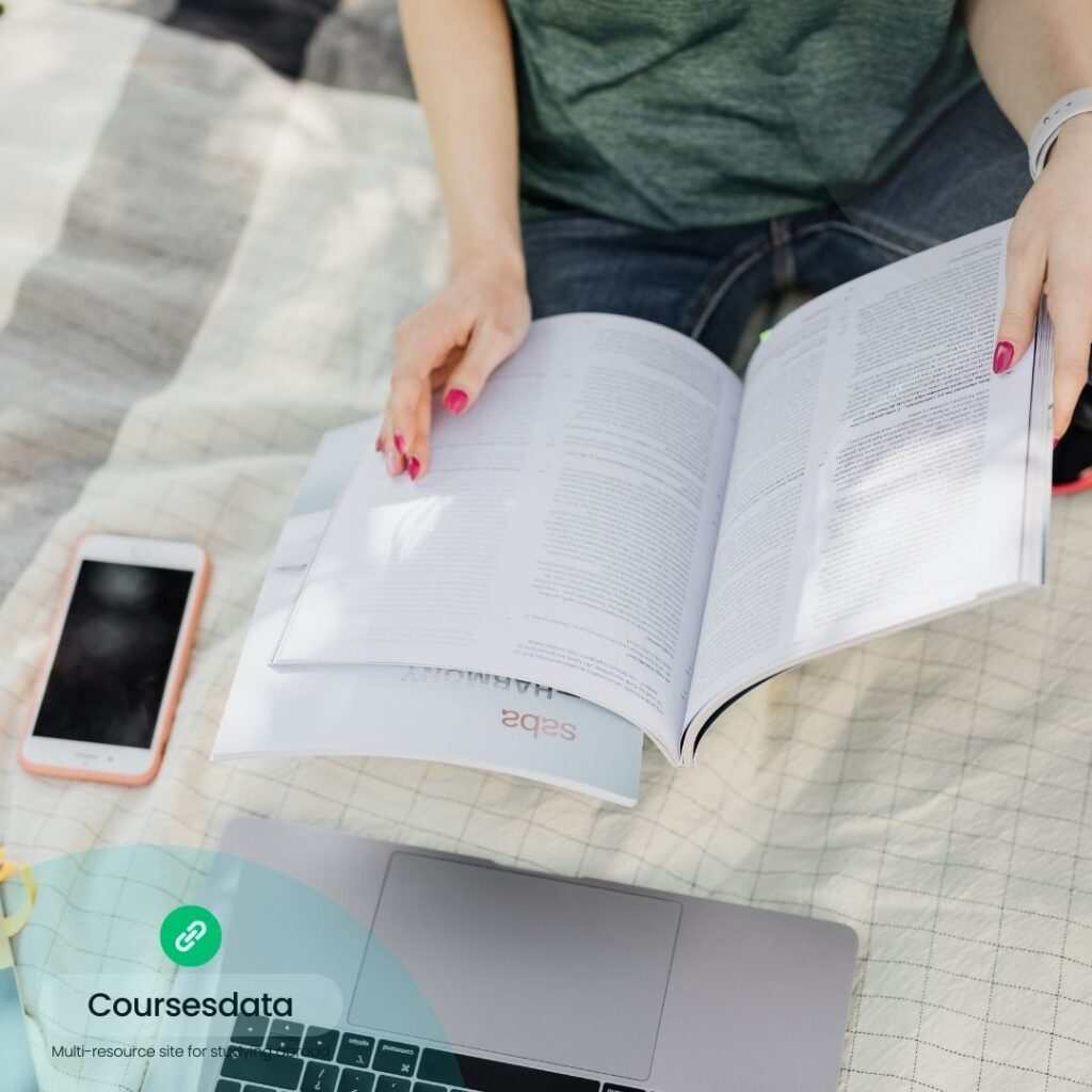Person studying with open textbook.