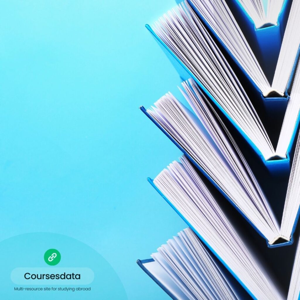 Books stacked against blue background.