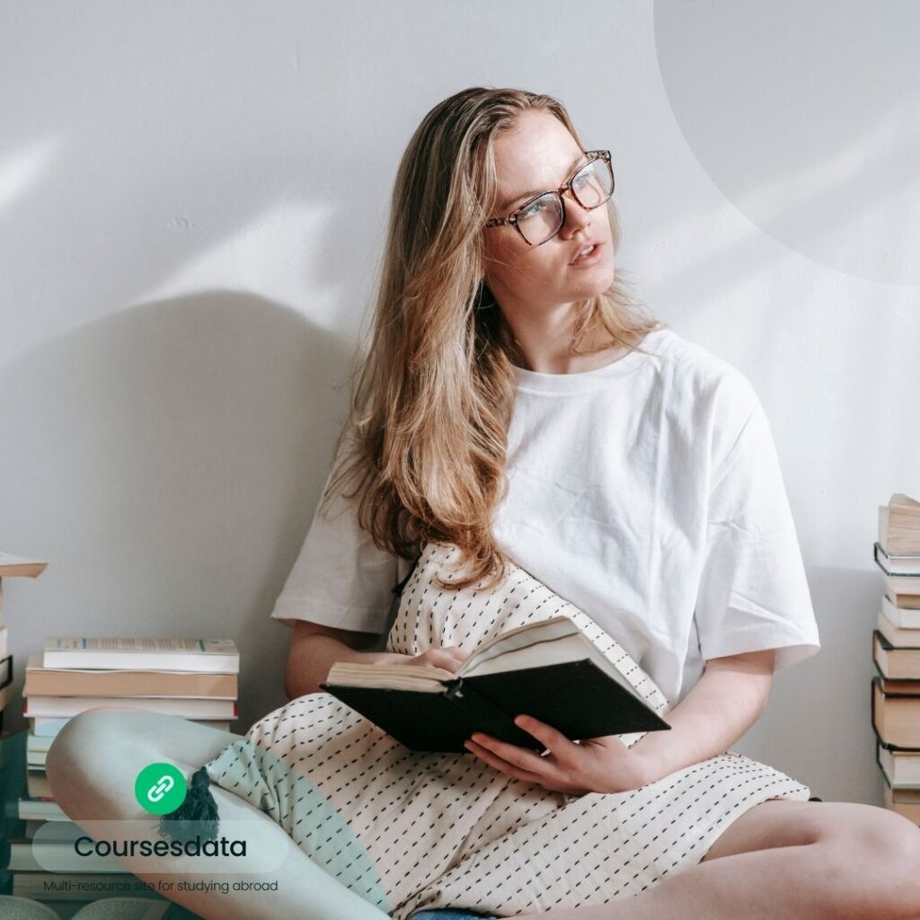 Young woman reading book intently.