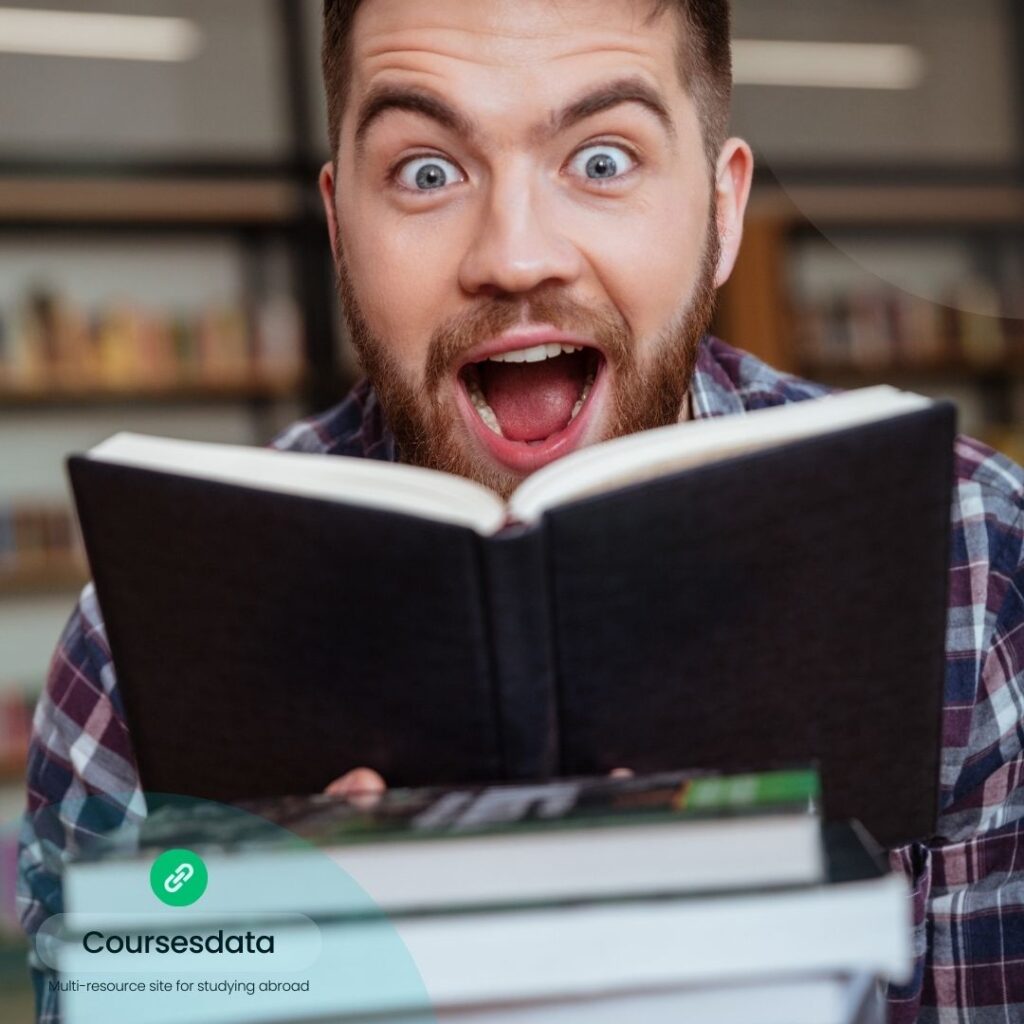 Excited man holding open book.