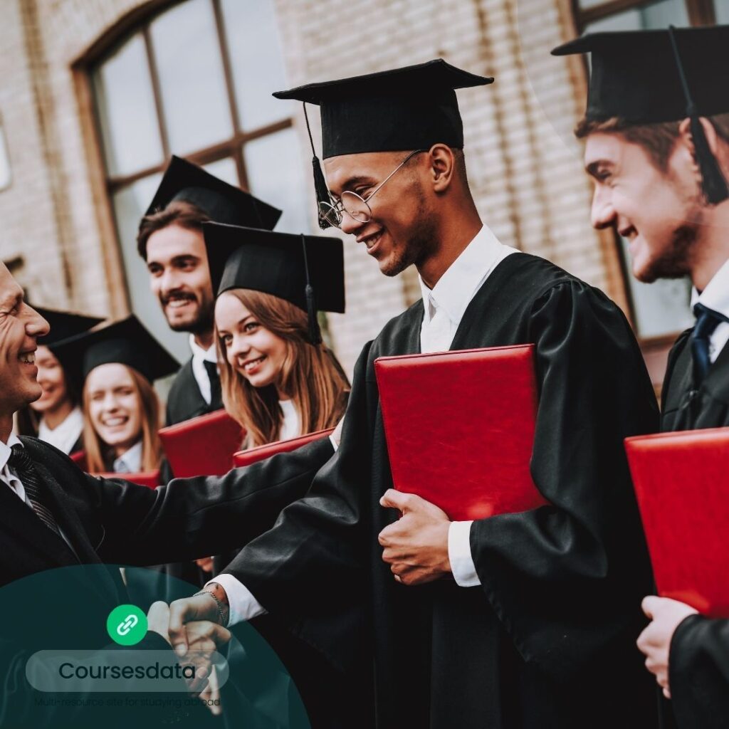 Graduation ceremony, happy graduates, handshake.