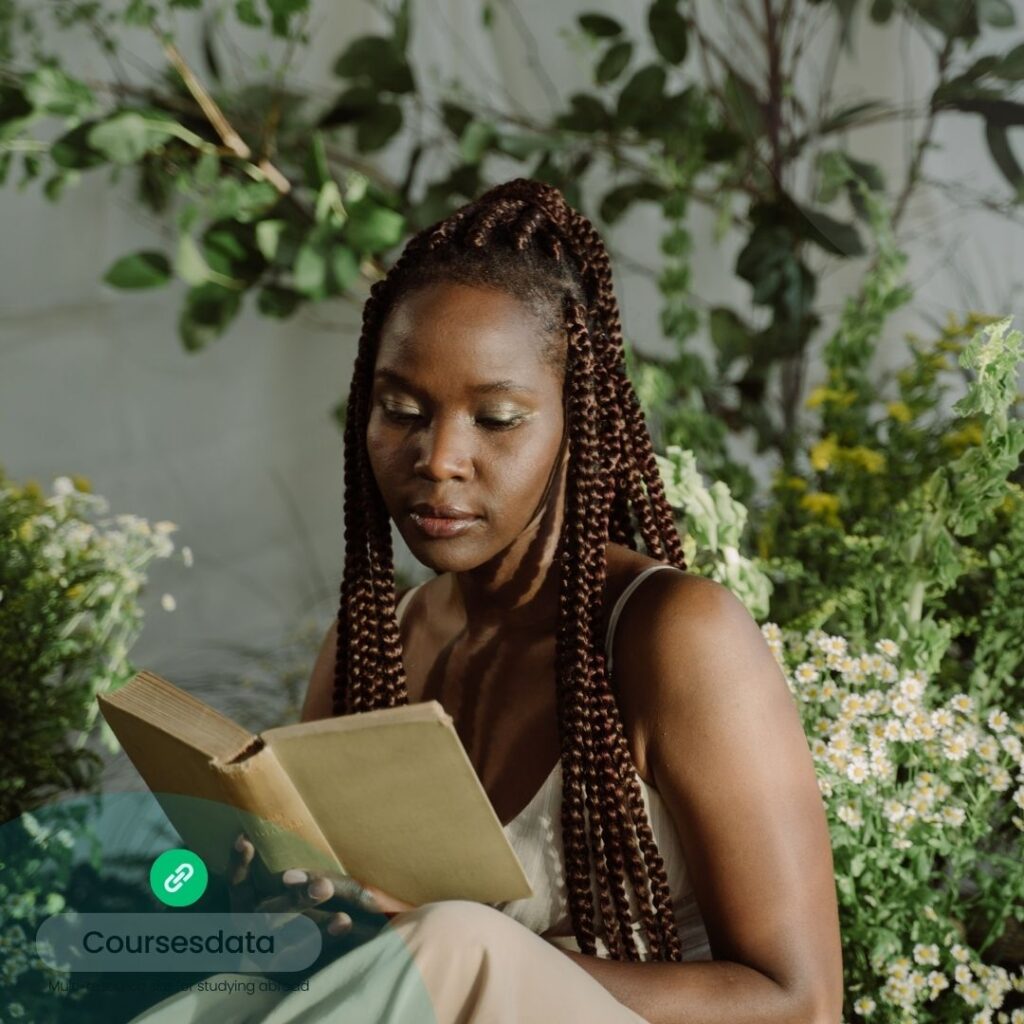 Woman reading book in garden.