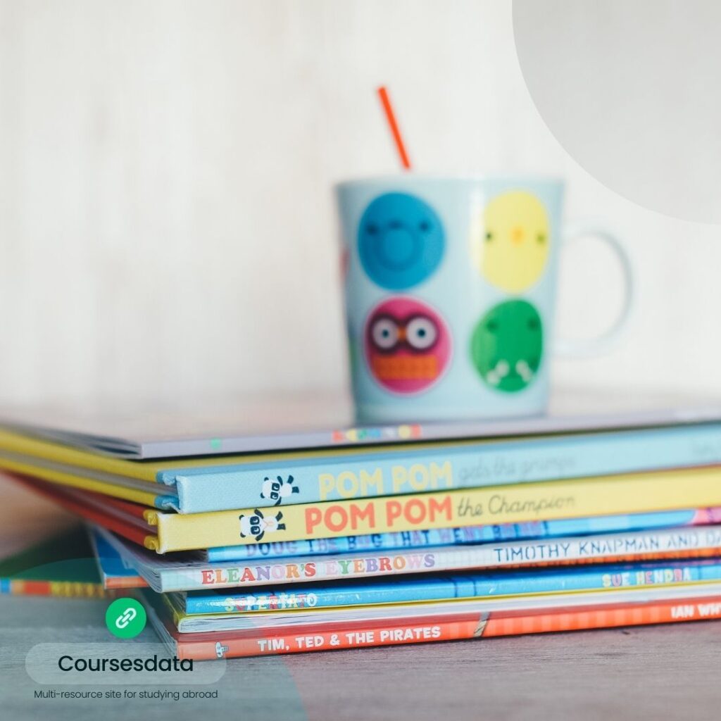 Colorful books with patterned mug.