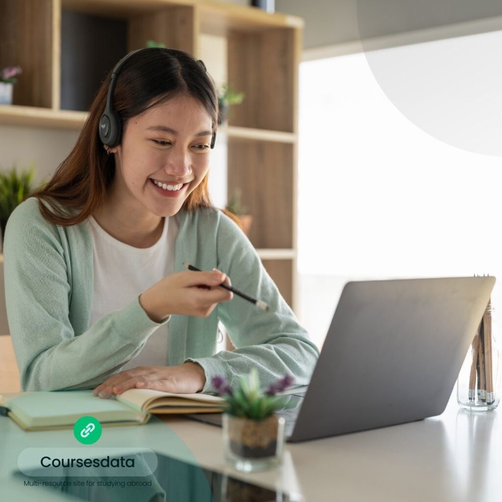 Smiling student studying online.