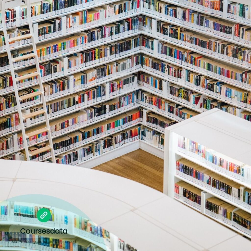 Colorful library bookshelves, wooden floor.