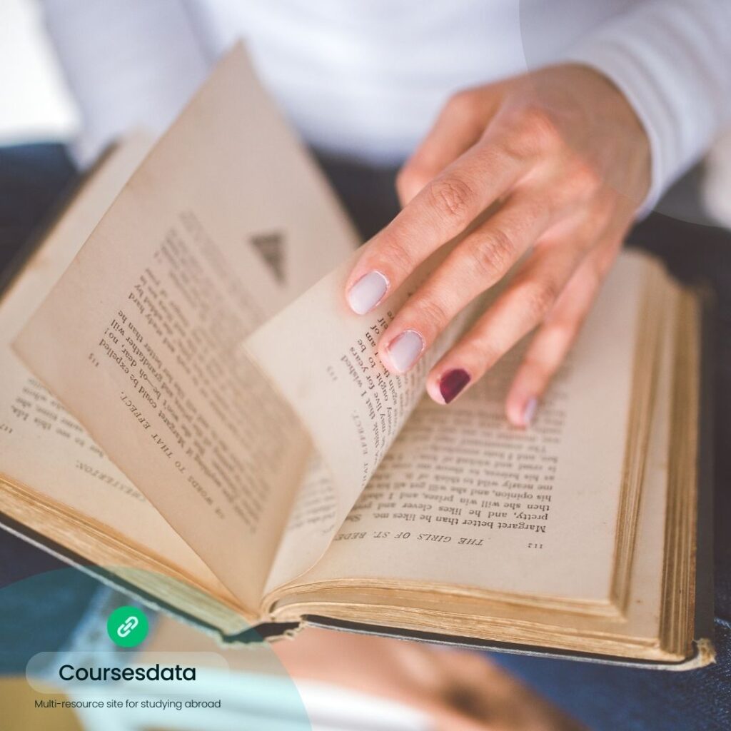 Person flipping through a book.