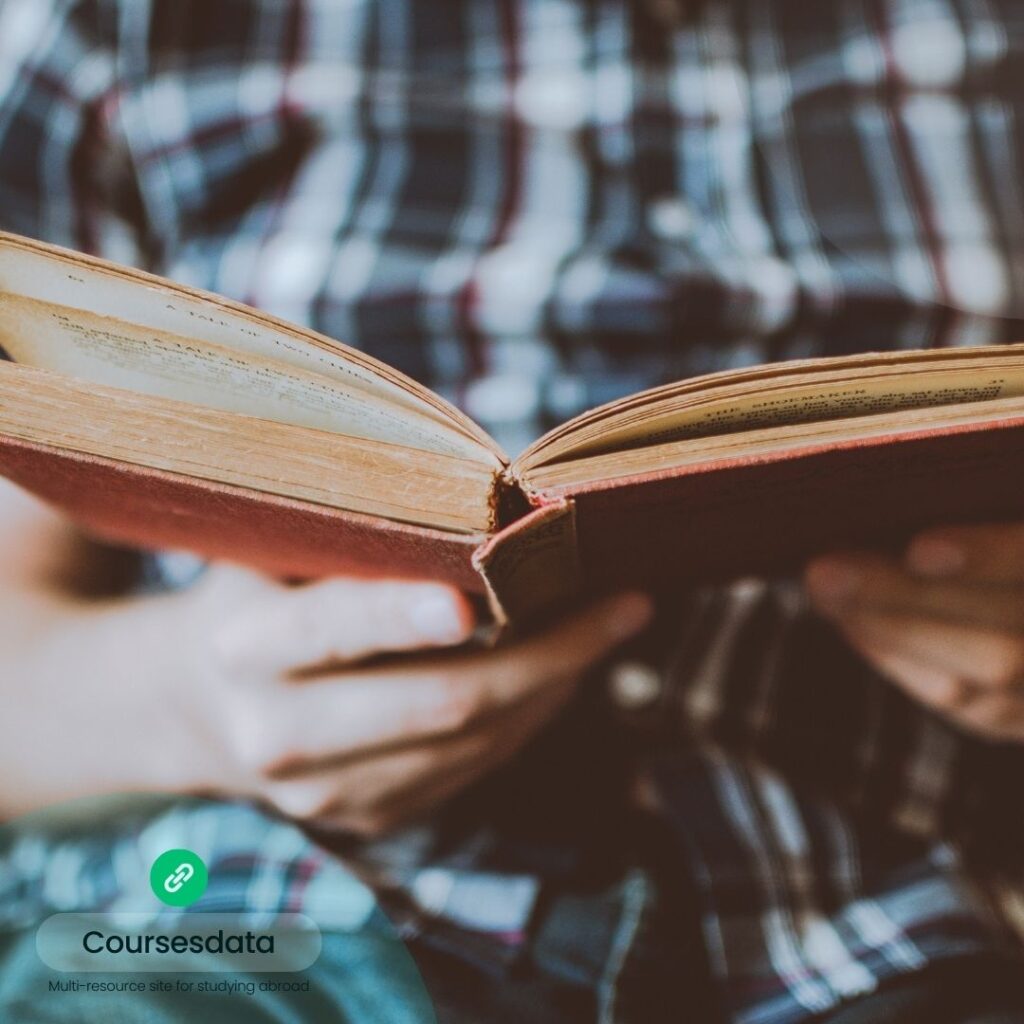 Person reading an old book.