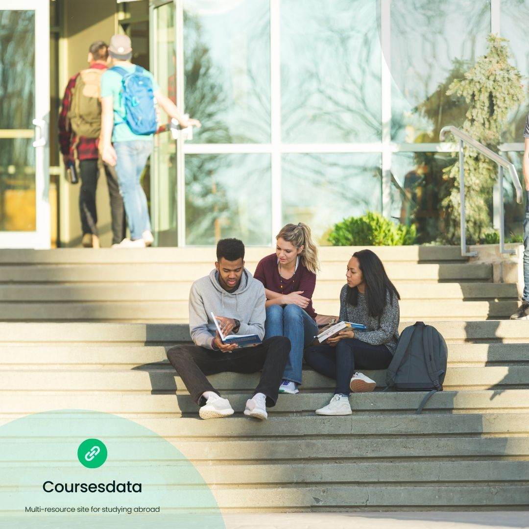 Students studying on campus steps.