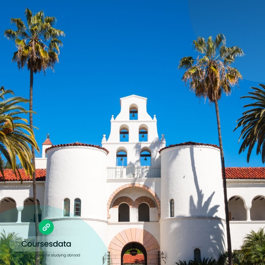 Historic building with palm trees.
