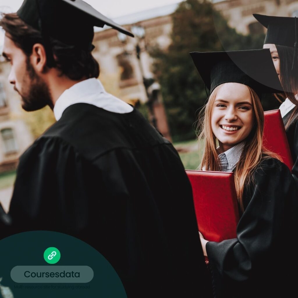 Smiling graduates in caps.