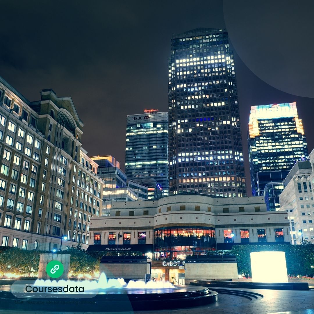 Nighttime cityscape with illuminated buildings.