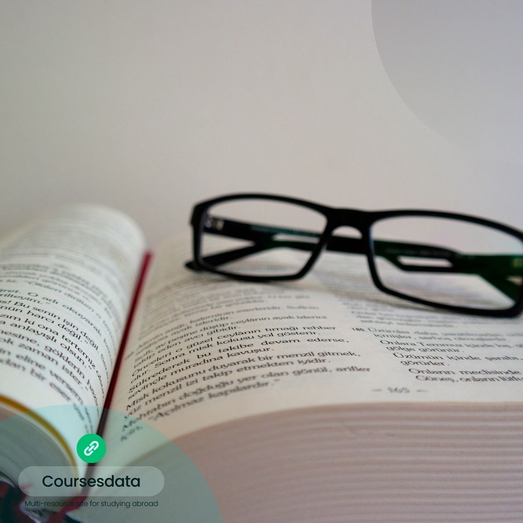 Open book with glasses resting.