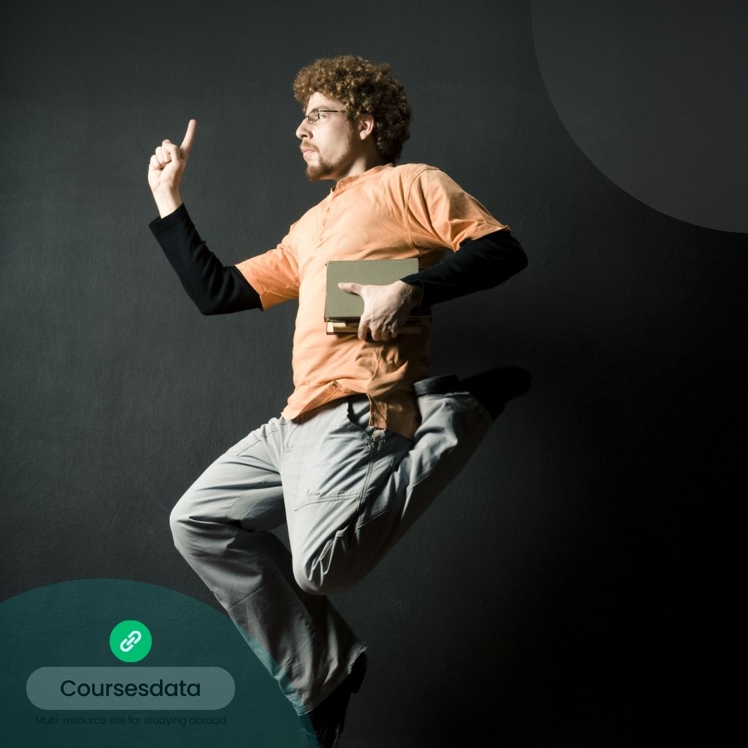 Person jumping, holding books.