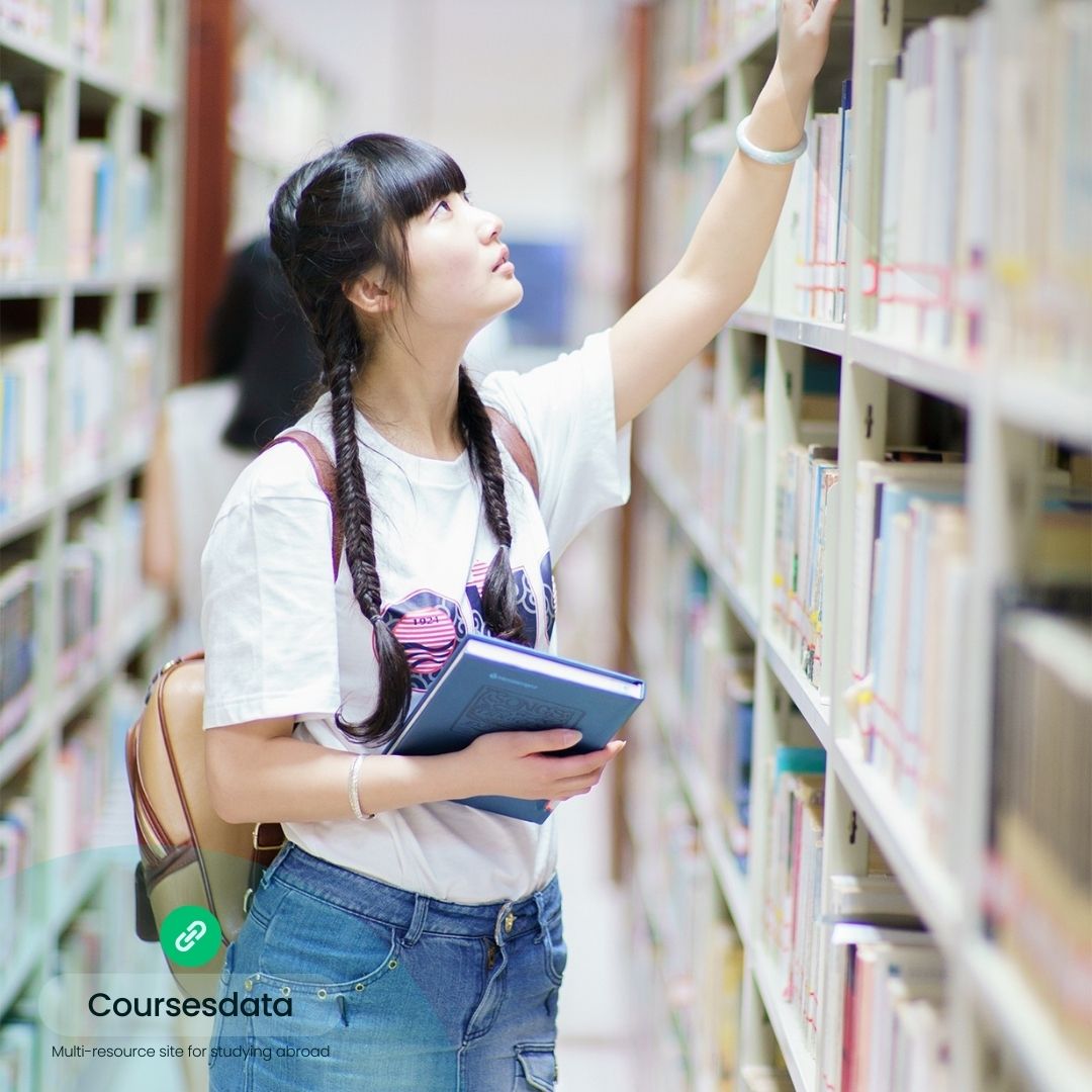 Young woman reaching for books.
