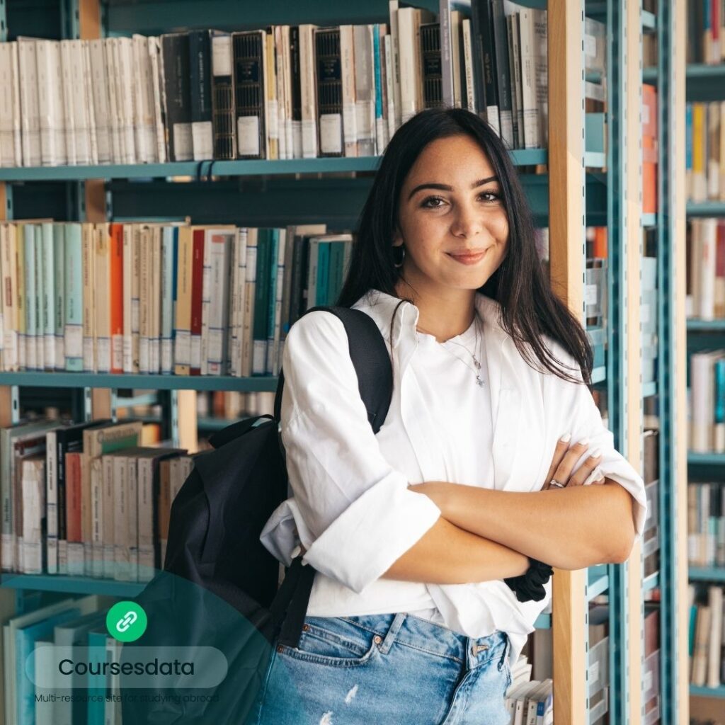 Student standing in library.