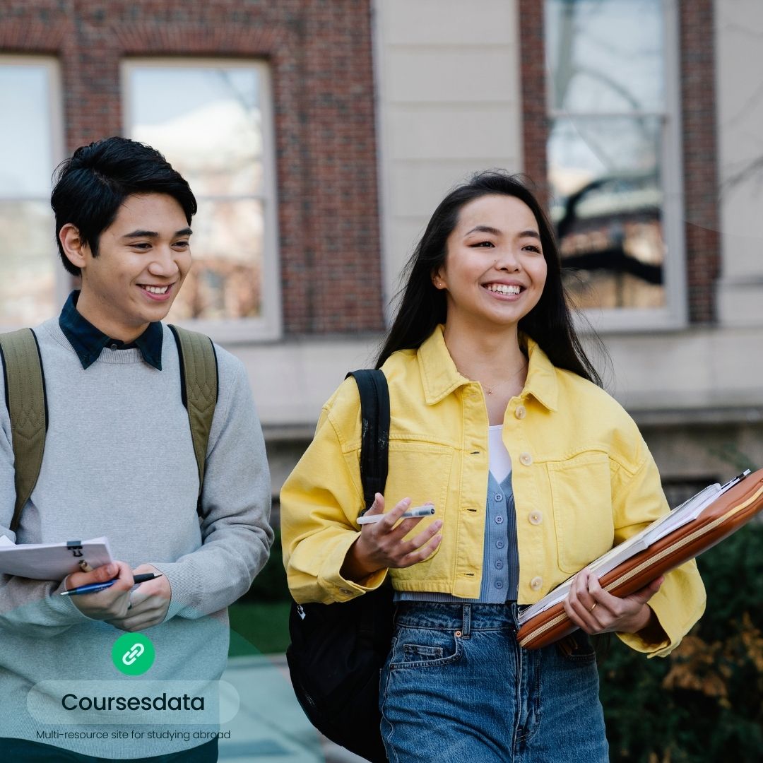 Smiling students walking outdoors.
