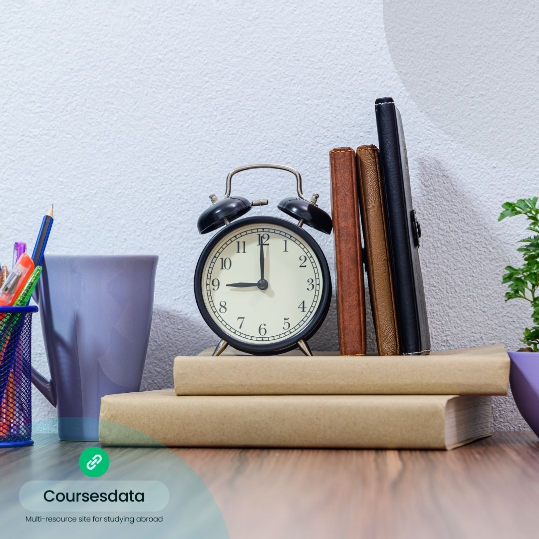 Desk with clock and books.