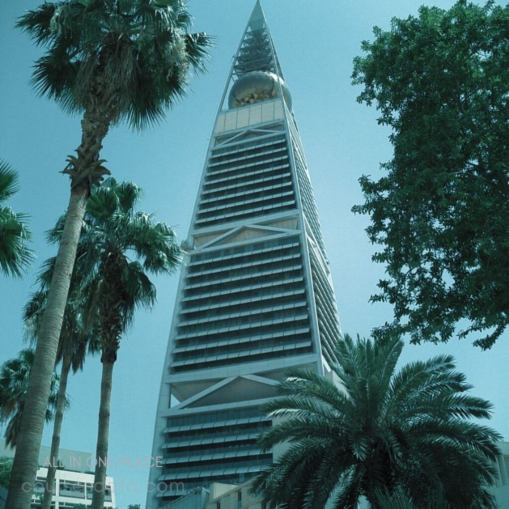 Towering skyscraper with palm trees.