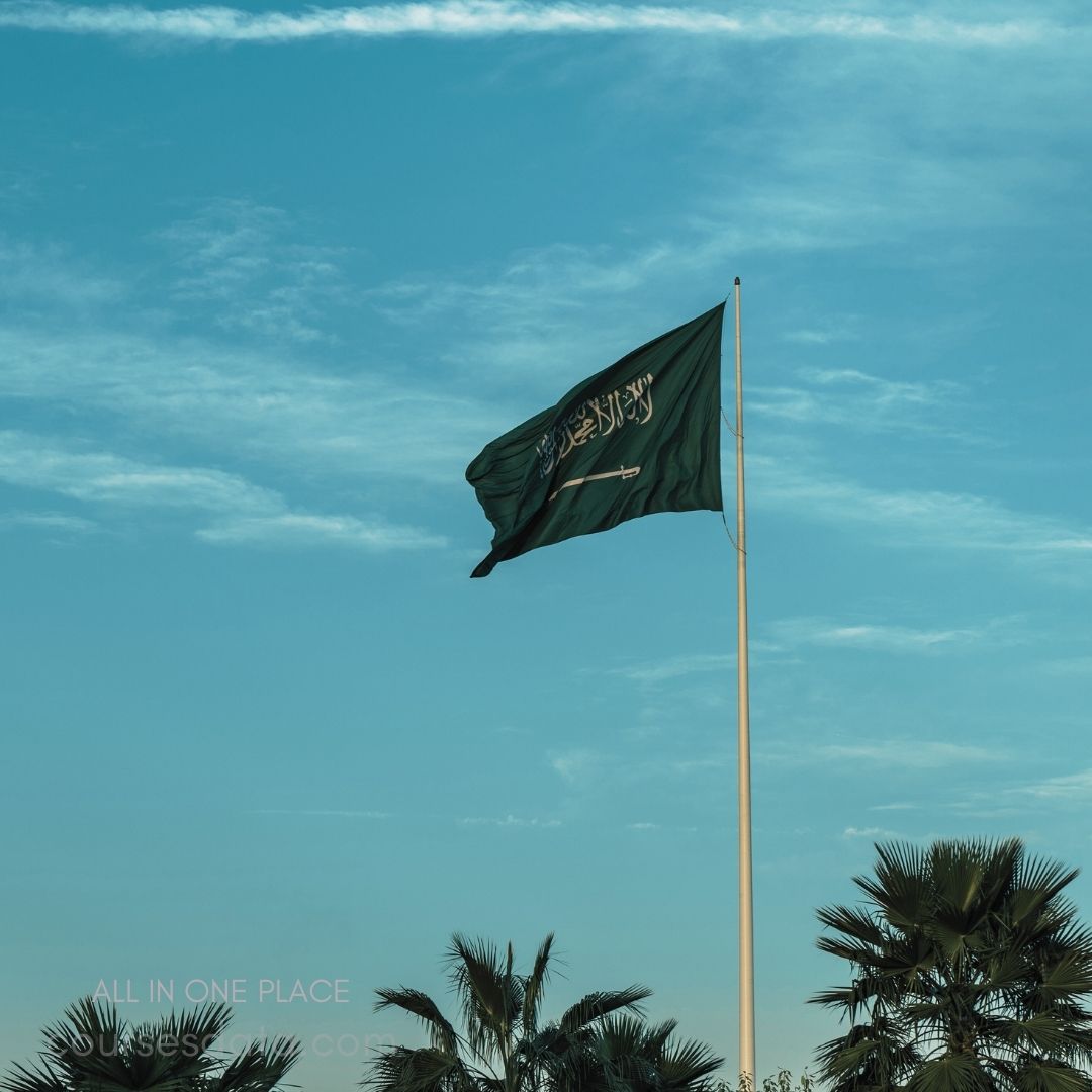 Saudi Arabian flag on pole.