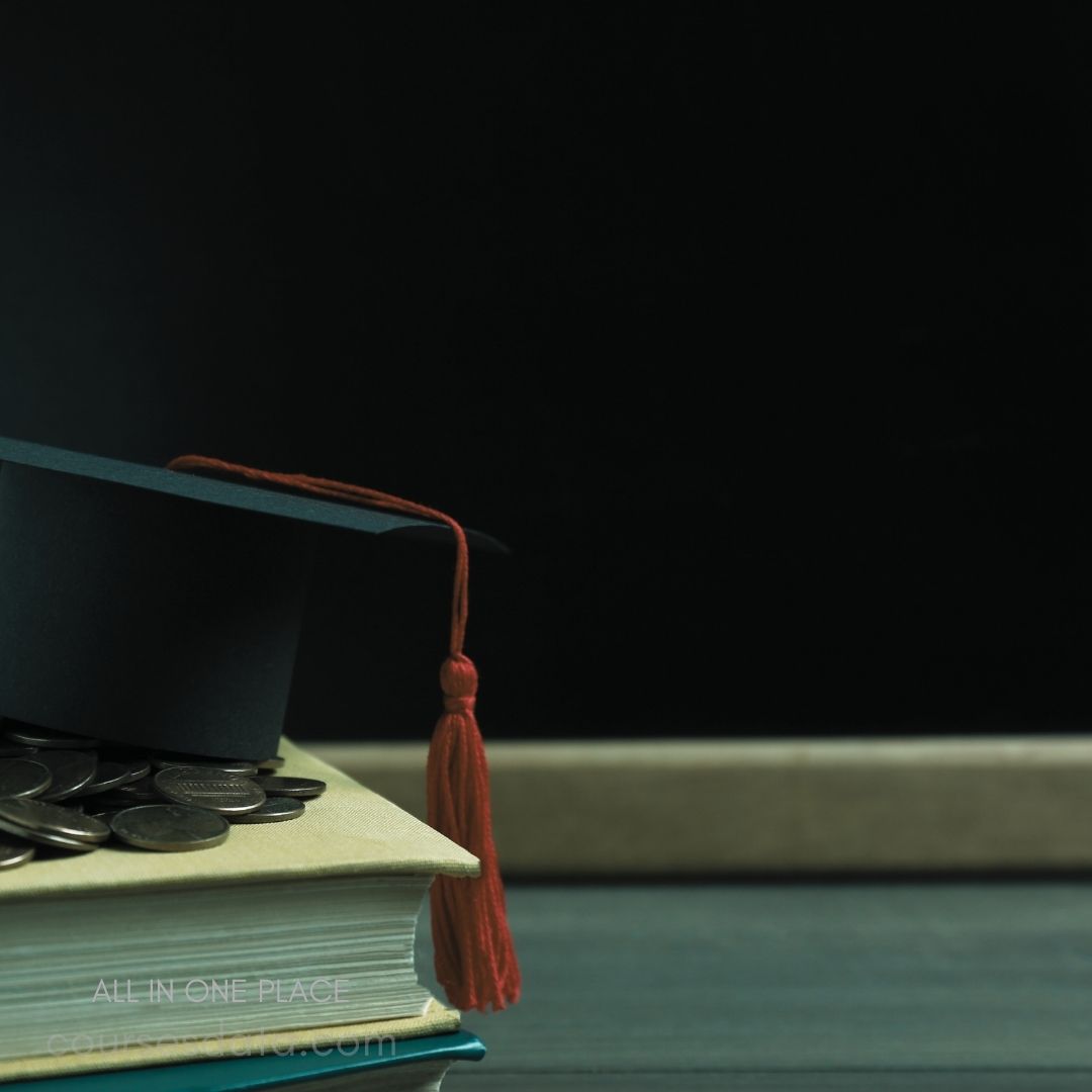 Graduation cap on stacked books. Coins scattered on the books. Dark background with subtle texture.